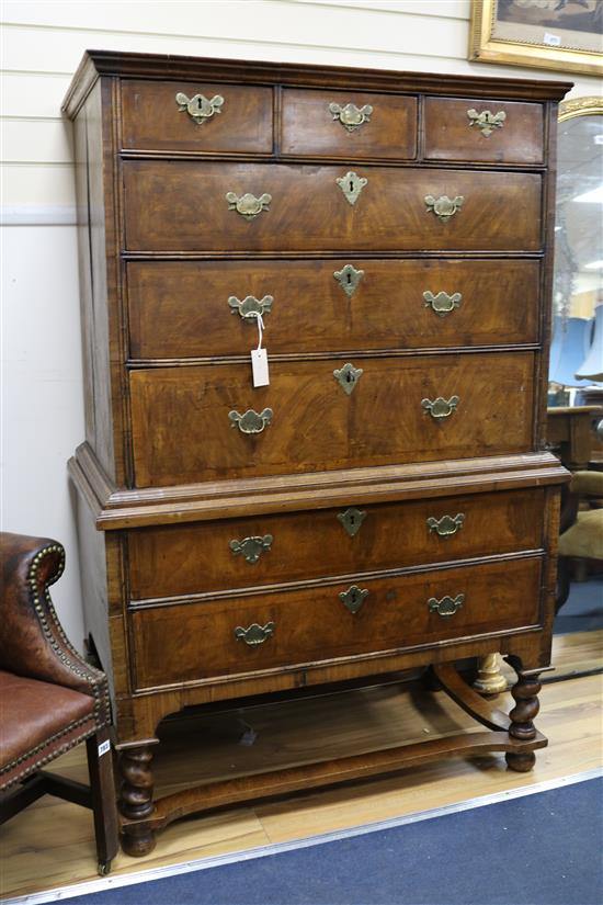 An early 18th century walnut chest on stand, H.159cm